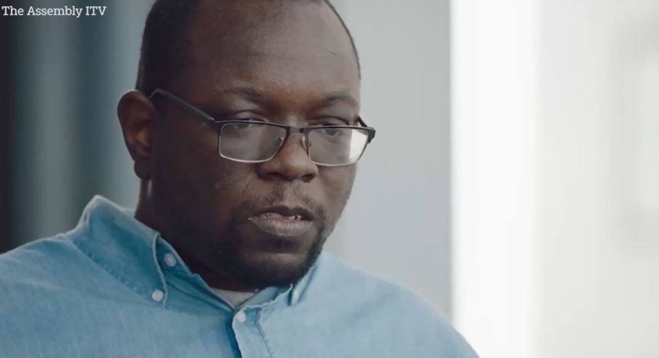 Man wearing glasses speaks.