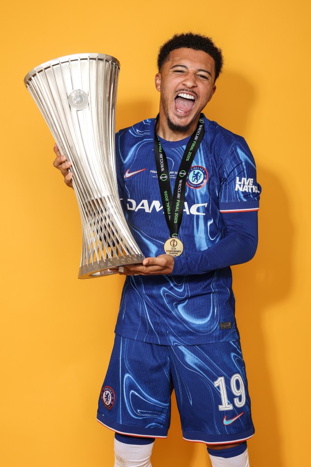 Jadon Sancho of Chelsea holding the UEFA Conference League trophy.