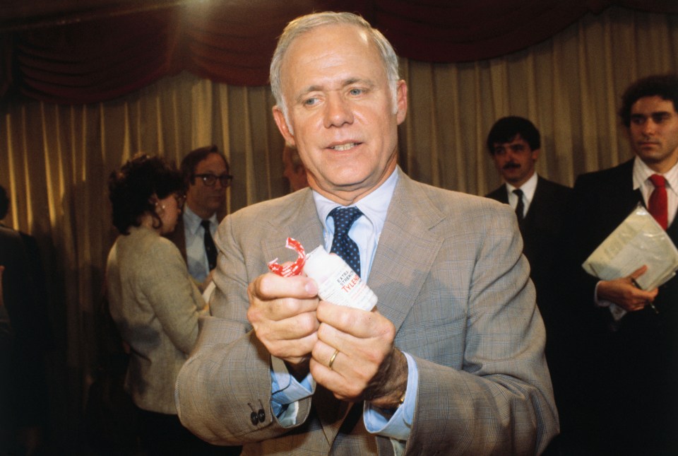 James Burke, a Johnson & Johnson executive, displays a new Tylenol bottle.