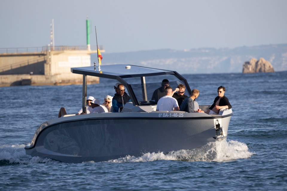 A group of men on a speedboat.