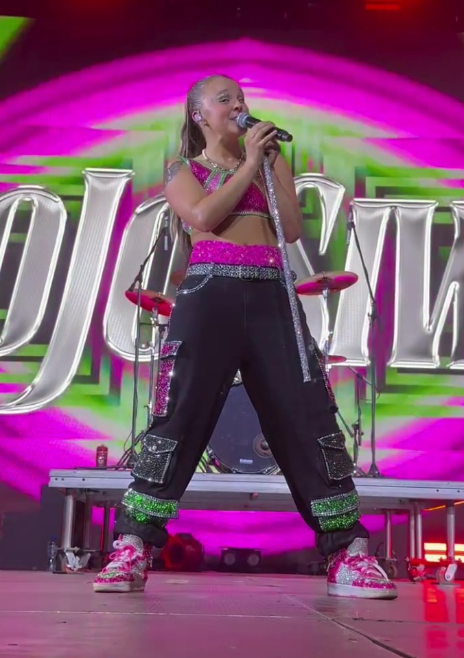 JoJo Siwa performing on stage.