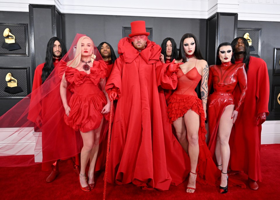 Kim Petras and Sam Smith with their team at the 65th Grammy Awards.