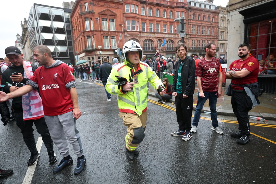 Emergency responder at a Liverpool trophy parade.