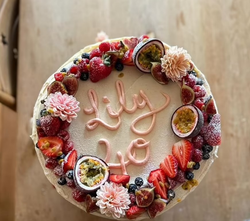 Lily's 40th birthday cake decorated with fruit and flowers.