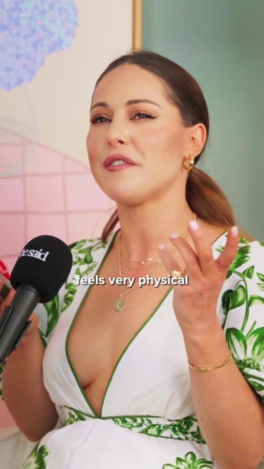Louise Thompson speaking into a microphone; text overlay reads "feels very physical".