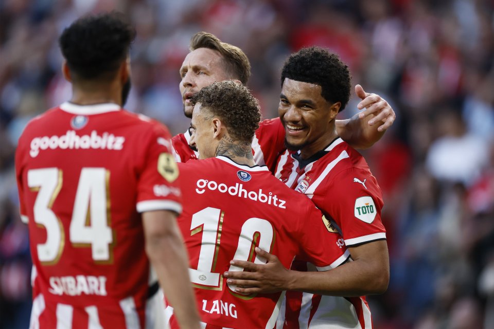PSV Eindhoven players celebrating a goal.