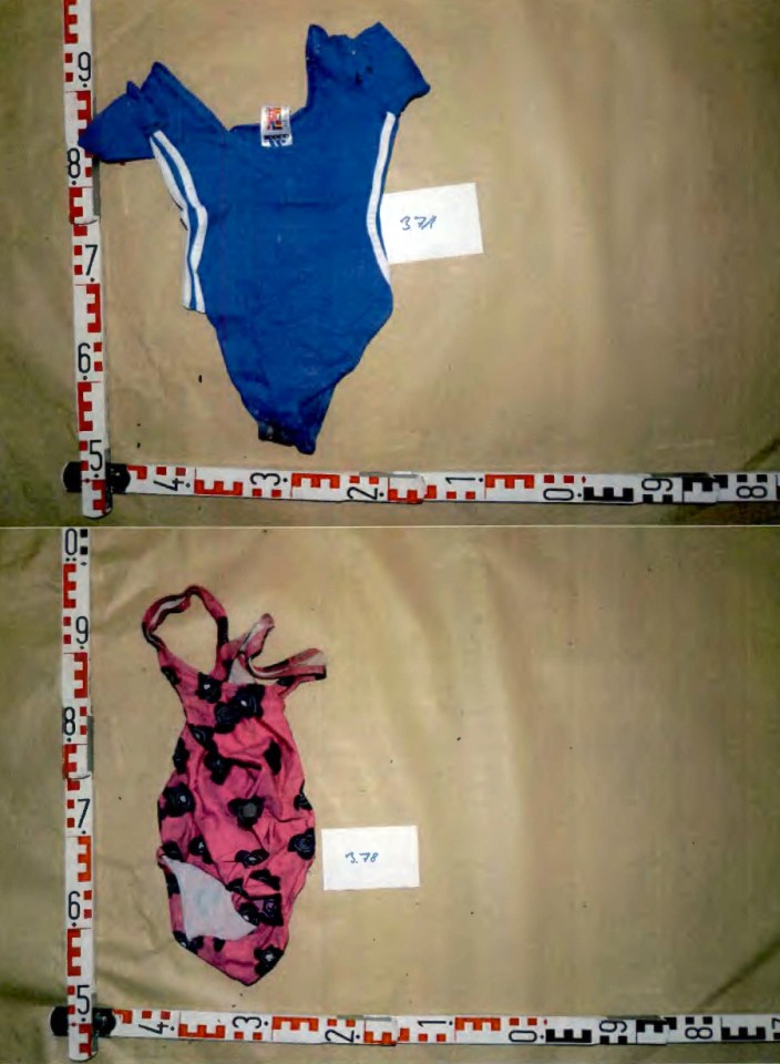 Two children's swimsuits laid out on a surface with measuring tapes.