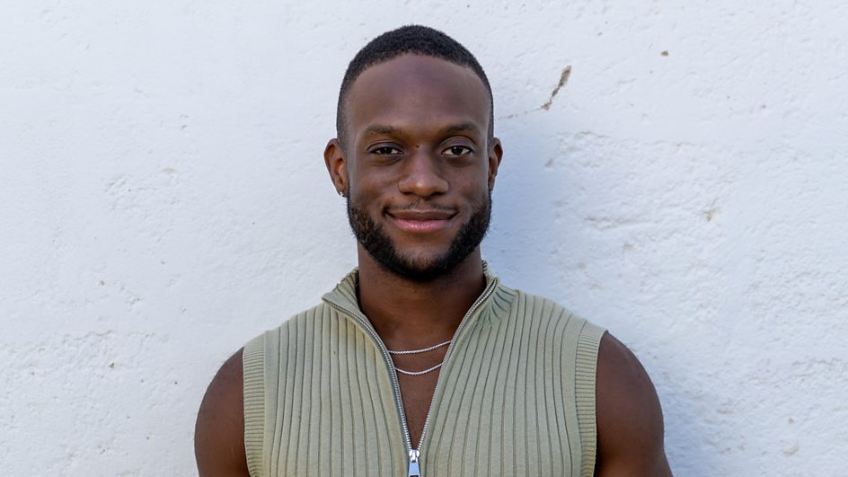 Portrait of Aron, a 27-year-old civil servant and cheerleading coach from Croydon.