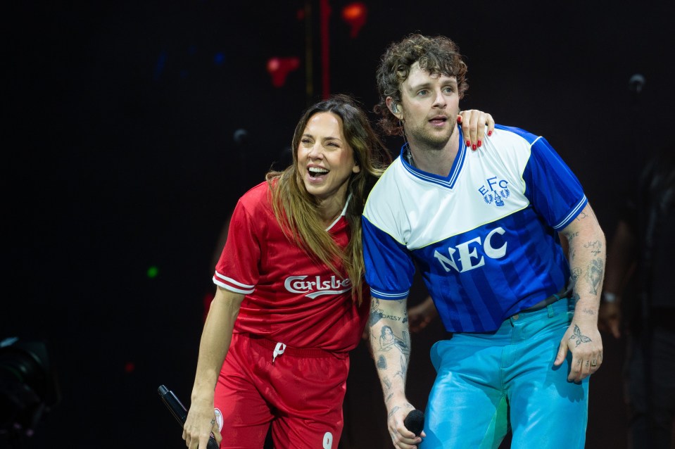 Mel C and Tom Grennan performing on stage.