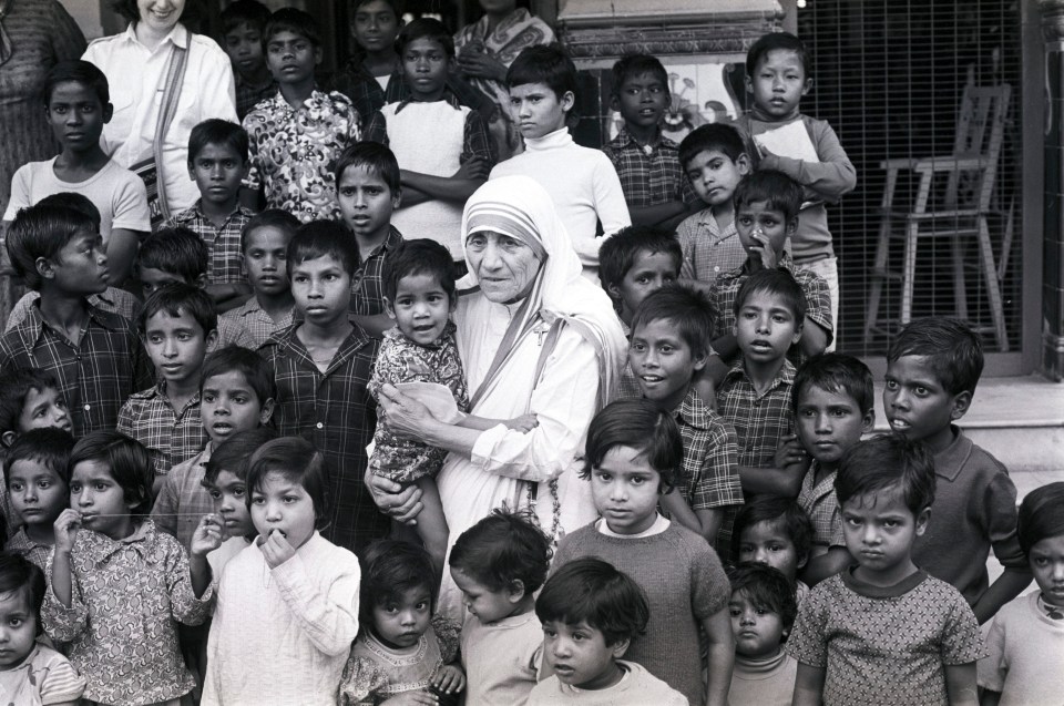 A picture file of Mother Teresa with some orphaned children during Prince Charles's visit to India December 1980