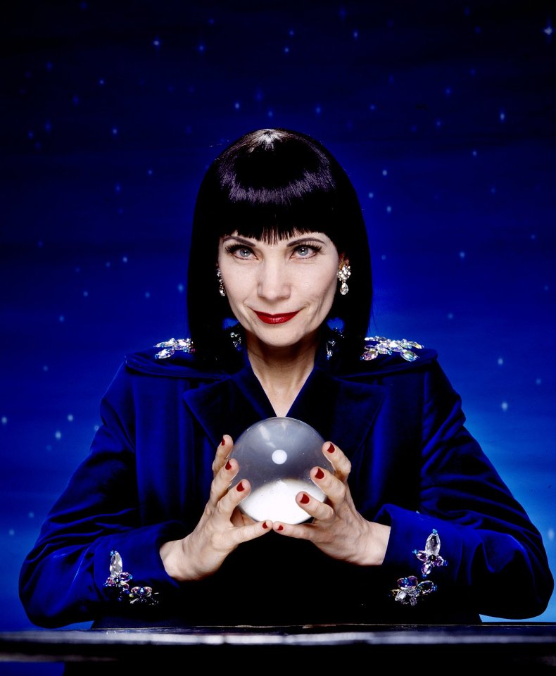 Mystic Meg, an astrologer and psychic, holding a crystal ball.