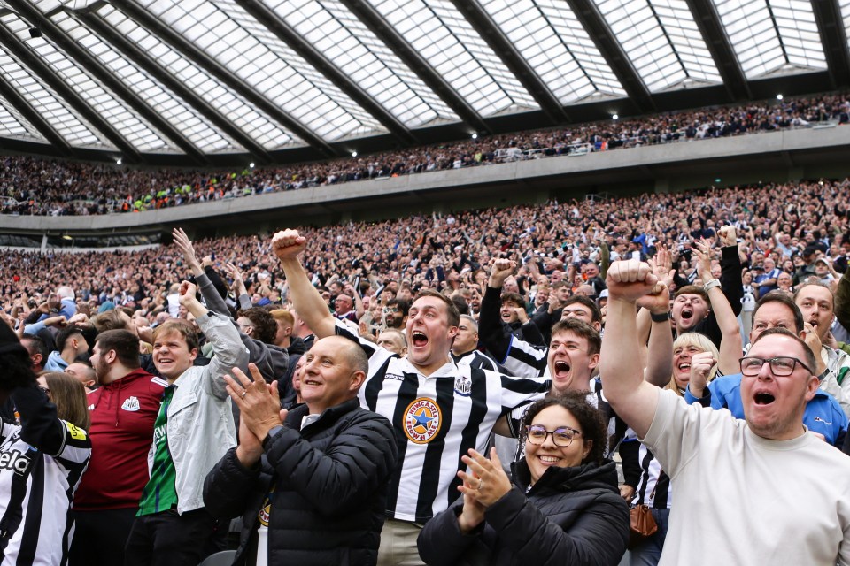 Newcastle United fans celebrating a goal at St James' Park.