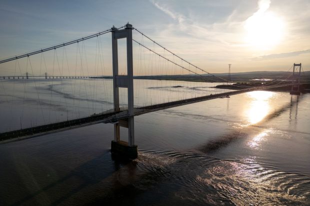 An image collage containing 1 images, Image 1 shows Aerial view of the Severn Bridge at sunset