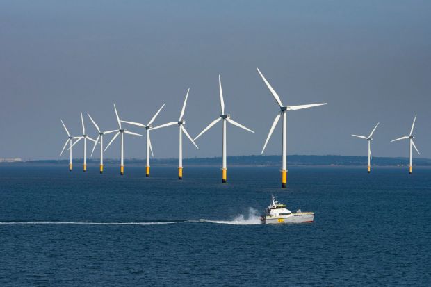 An image collage containing 1 images, Image 1 shows Offshore wind farm with a supply vessel