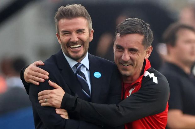 An image collage containing 1 images, Image 1 shows David Beckham and Gary Neville embracing at a soccer match