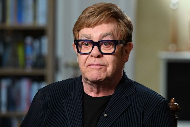 An image collage containing 1 images, Image 1 shows Sir Elton John in a televised interview