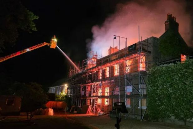 An image collage containing 1 images, Image 1 shows Firefighters battling a house fire at night