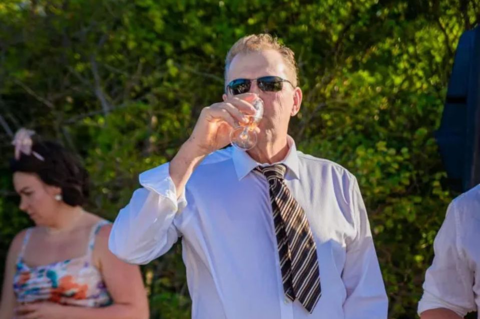 An image collage containing 1 images, Image 1 shows Man drinking from a glass at an outdoor event