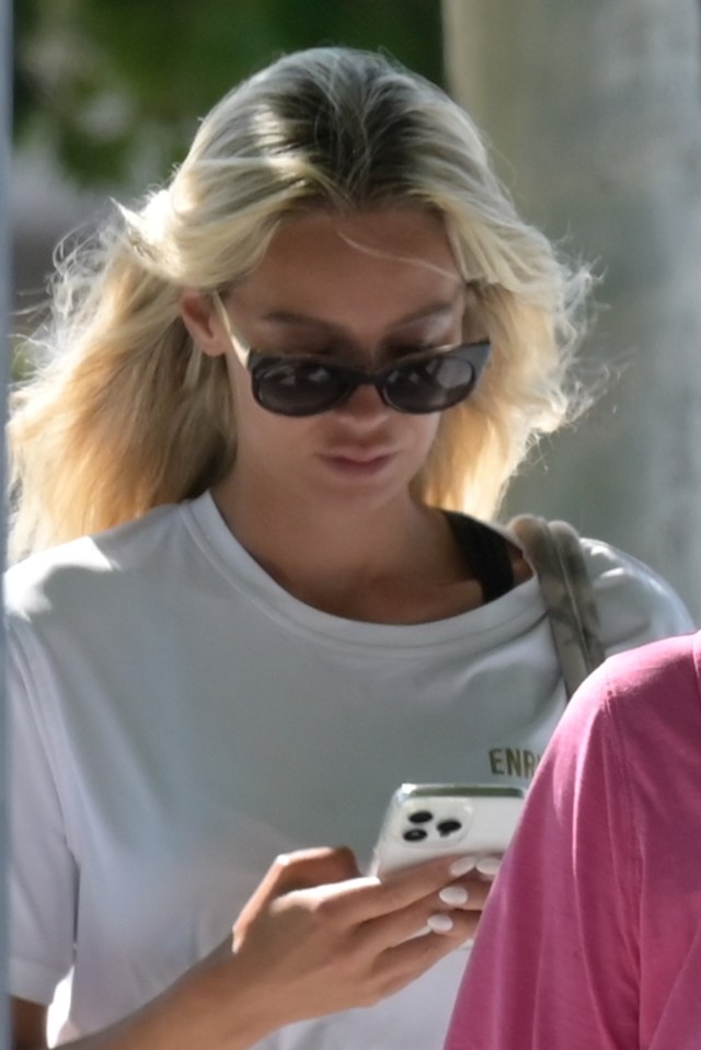 Nicoline Artursson looking at her phone.