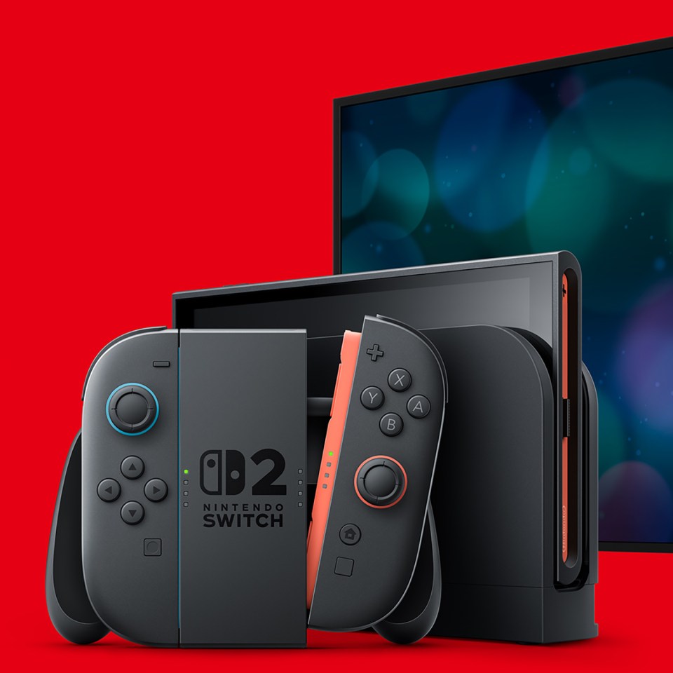 Nintendo Switch OLED model with controllers and TV screen.