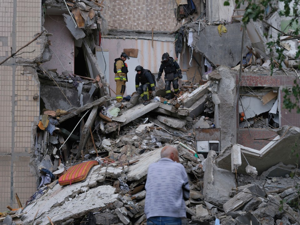 Rescue workers clearing rubble from a destroyed building in Kostiantynivka, Ukraine.