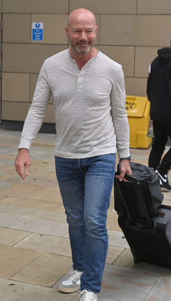 Micah Richards arriving with luggage.