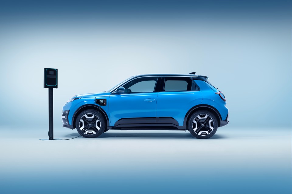 Blue electric car charging at a station.