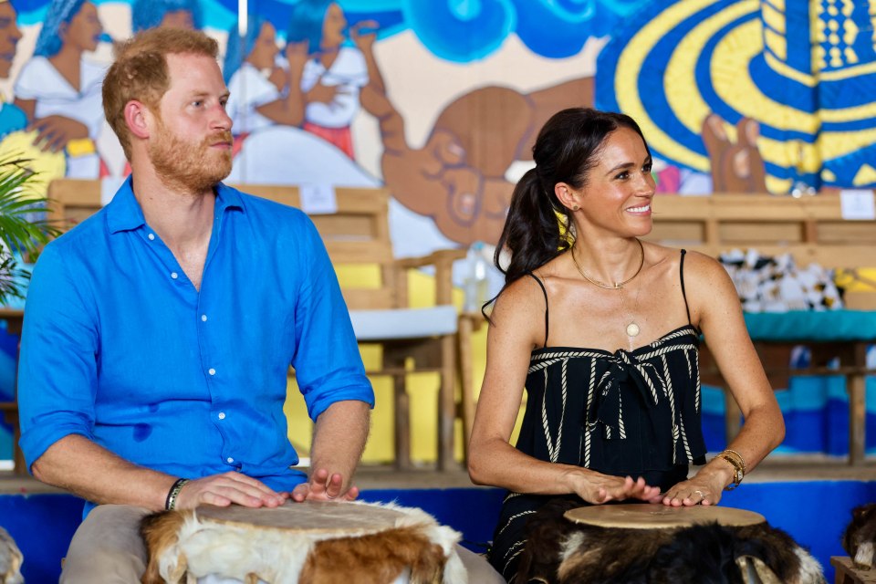 Prince Harry and Meghan Markle playing drums at a Caribbean drumming school.