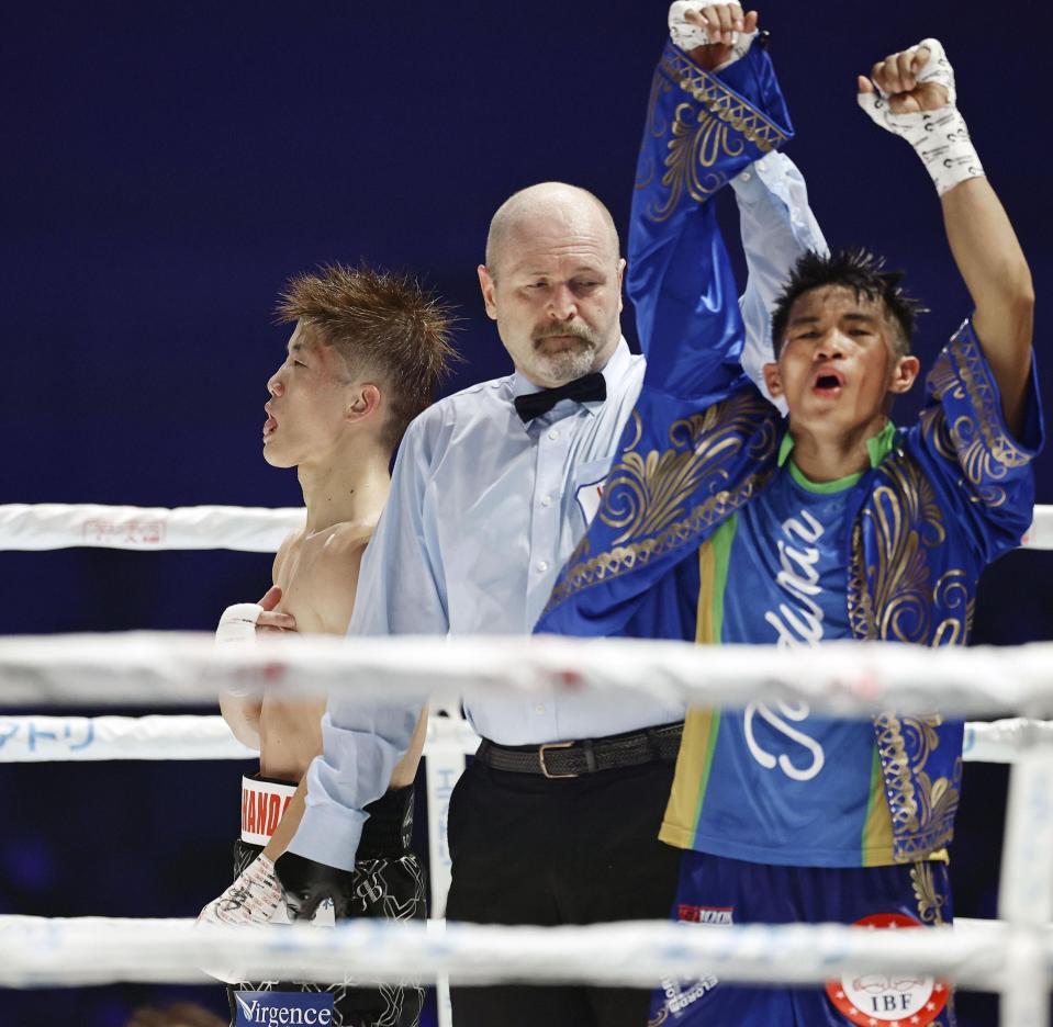 Boxer Pedro Taduran celebrates retaining his IBF minimumweight title.
