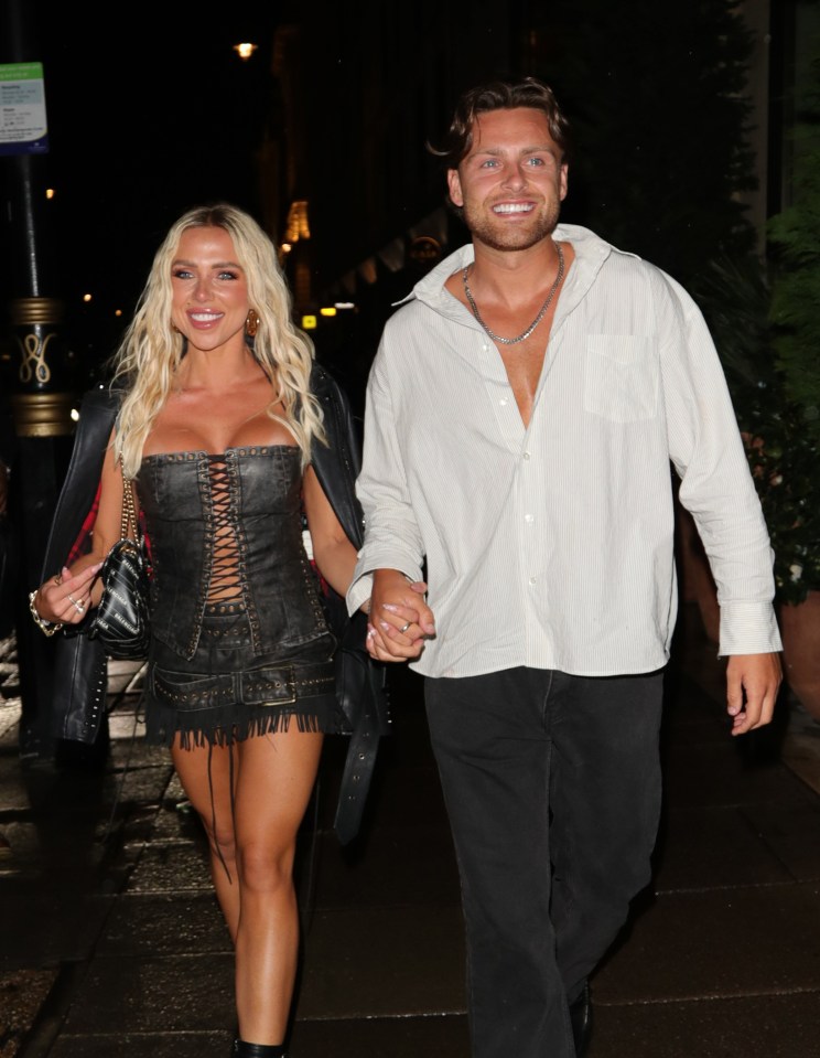 Gabby Allen and Casey O'Gorman holding hands.