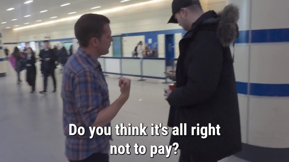 Two men talking in a hallway; one man asks, "Do you think it's all right not to pay?"