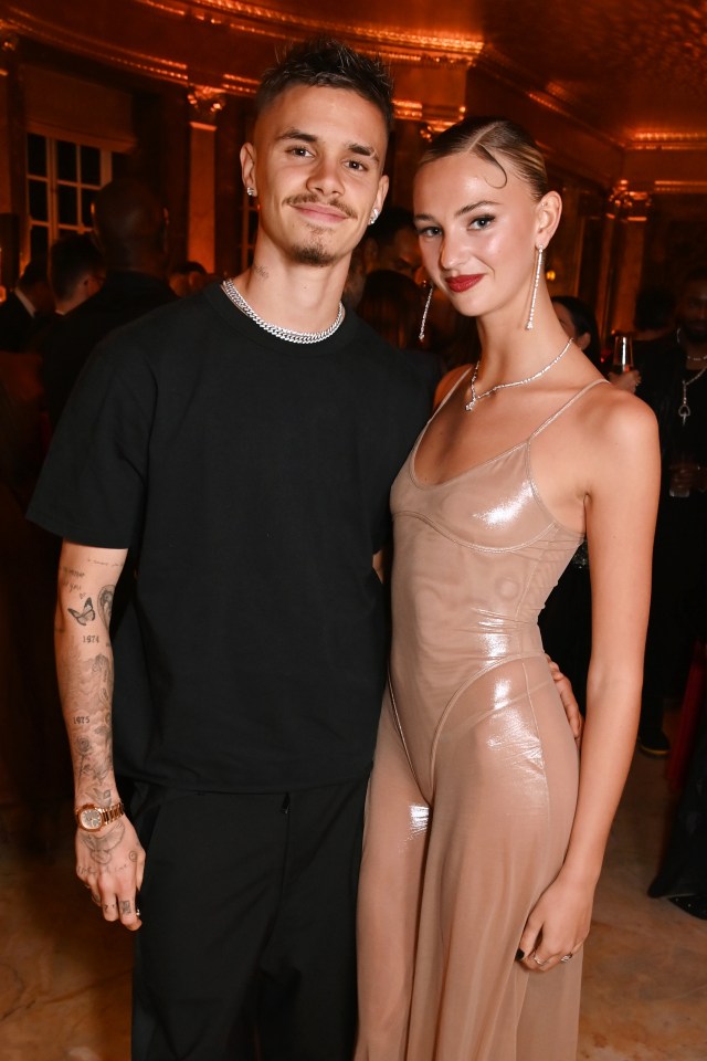 Romeo Beckham and Mia Regan at an awards ceremony.