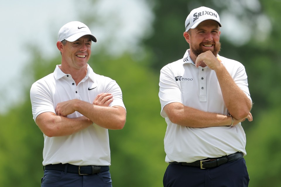 Rory McIlroy and Shane Lowry at a golf tournament.