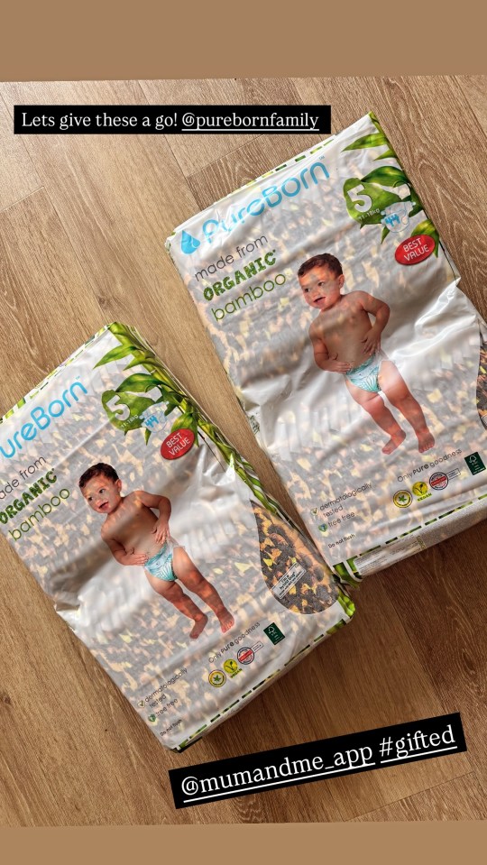 Two packages of PureBorn organic bamboo baby diapers.