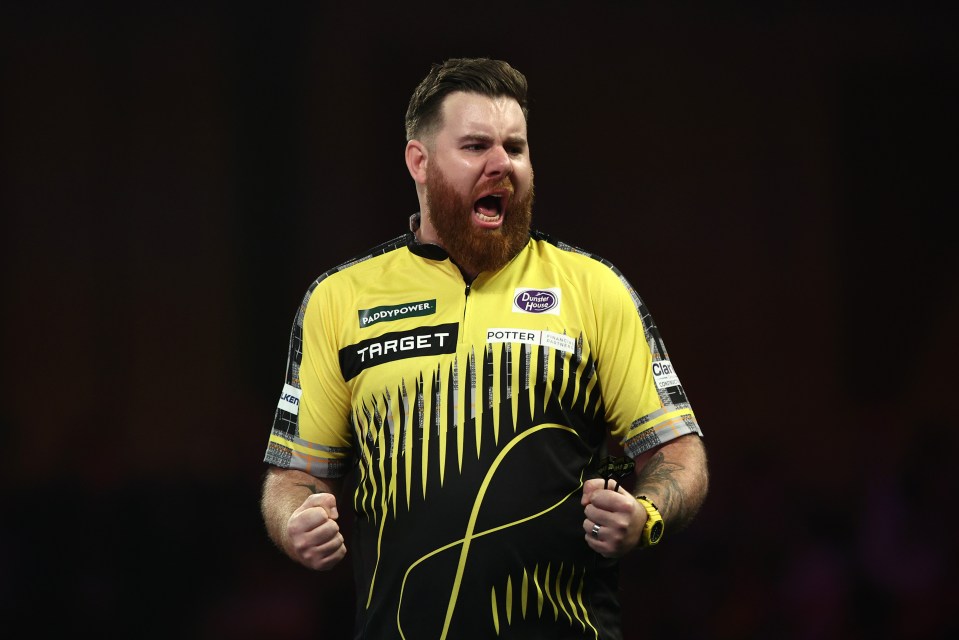 Scott Williams of England celebrates a darts victory.