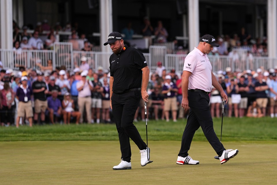 Shane Lowry and Sepp Straka walking on the 18th hole.
