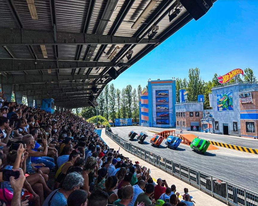 Hot Wheels City Stuntman Show audience watching cars perform stunts.