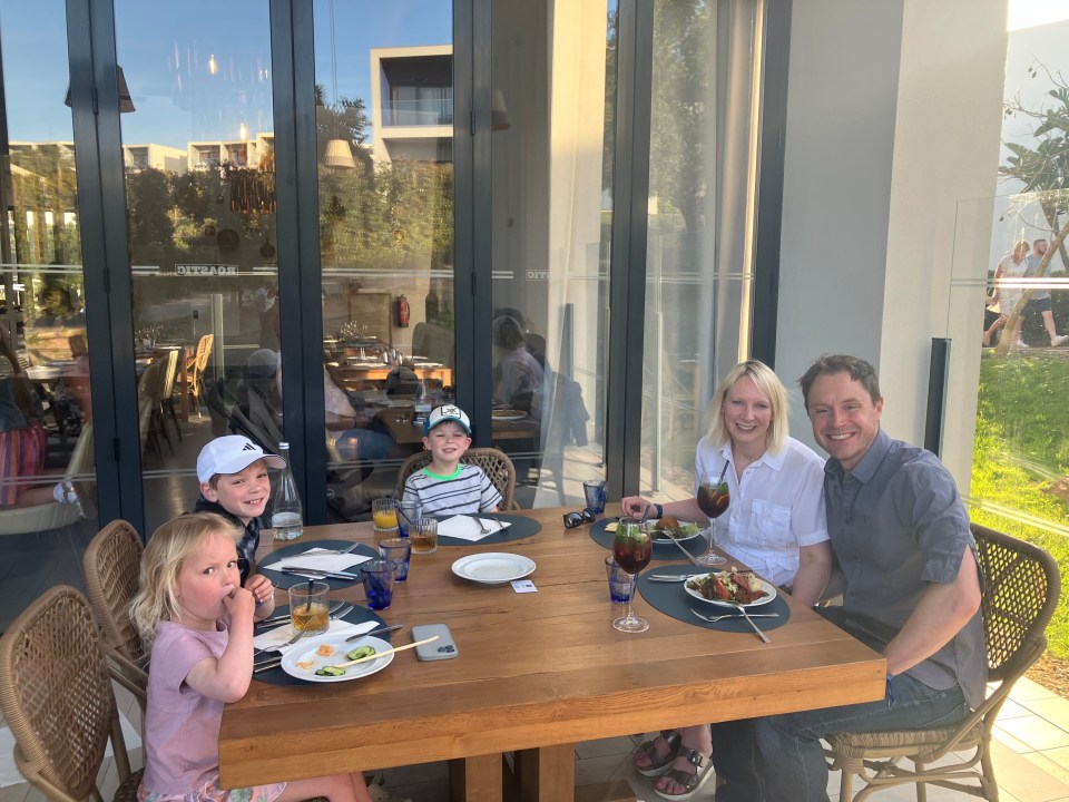 Family dining outdoors at a restaurant.