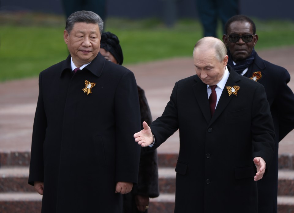 Presidents Putin and Xi Jinping at a wreath-laying ceremony.