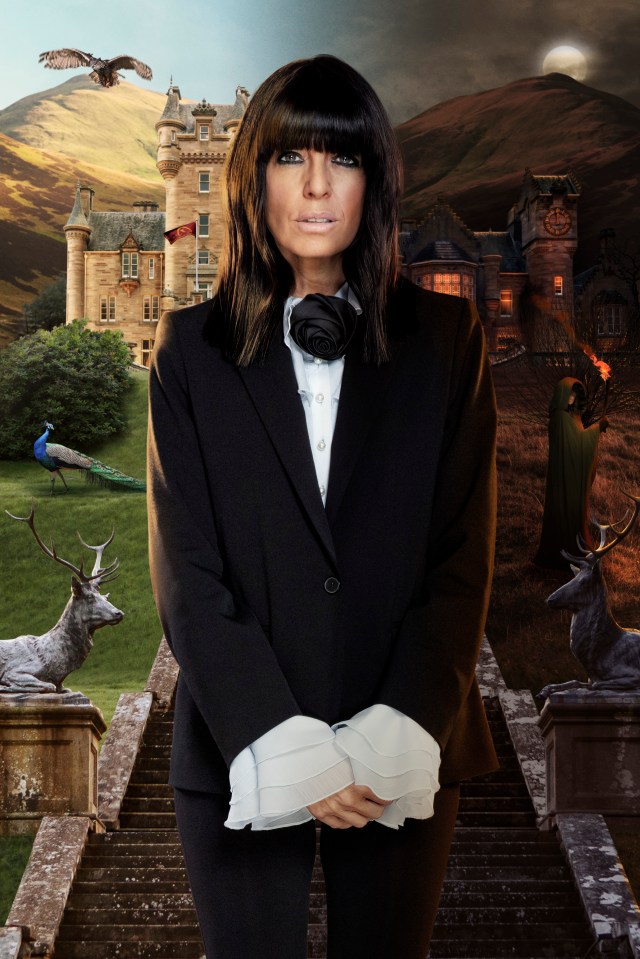 Claudia Winkleman in a black suit, standing on a staircase between two contrasting castles.