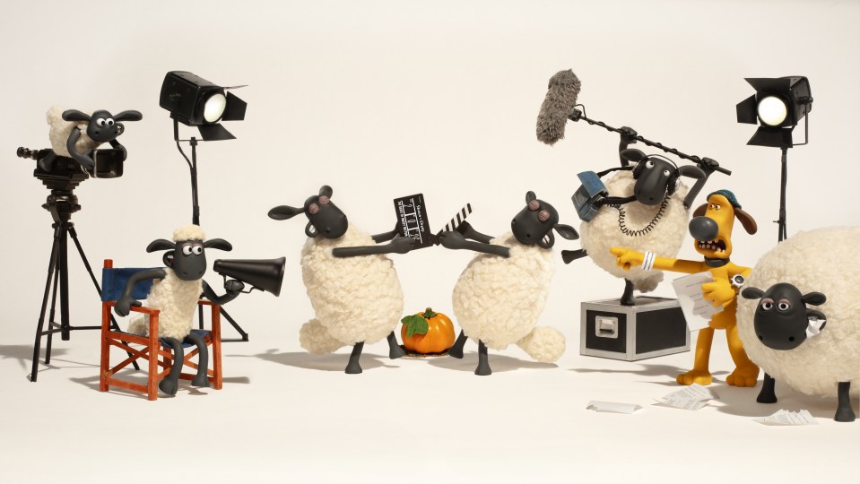 Illustration of Shaun the Sheep characters filming a movie.