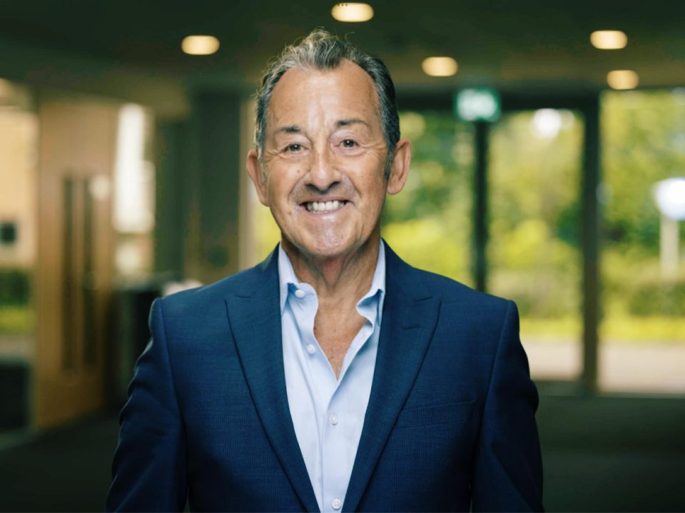 Portrait of a smiling man in a suit.