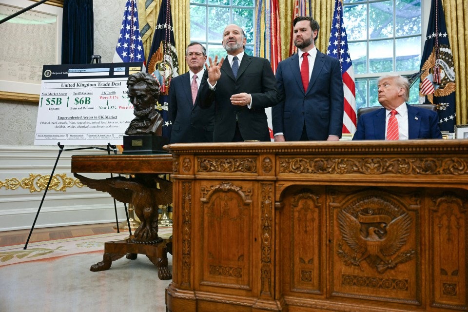 President Trump and aides at a White House trade announcement.