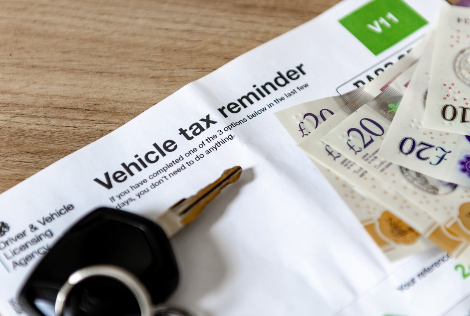 Vehicle tax reminder with car keys and cash.