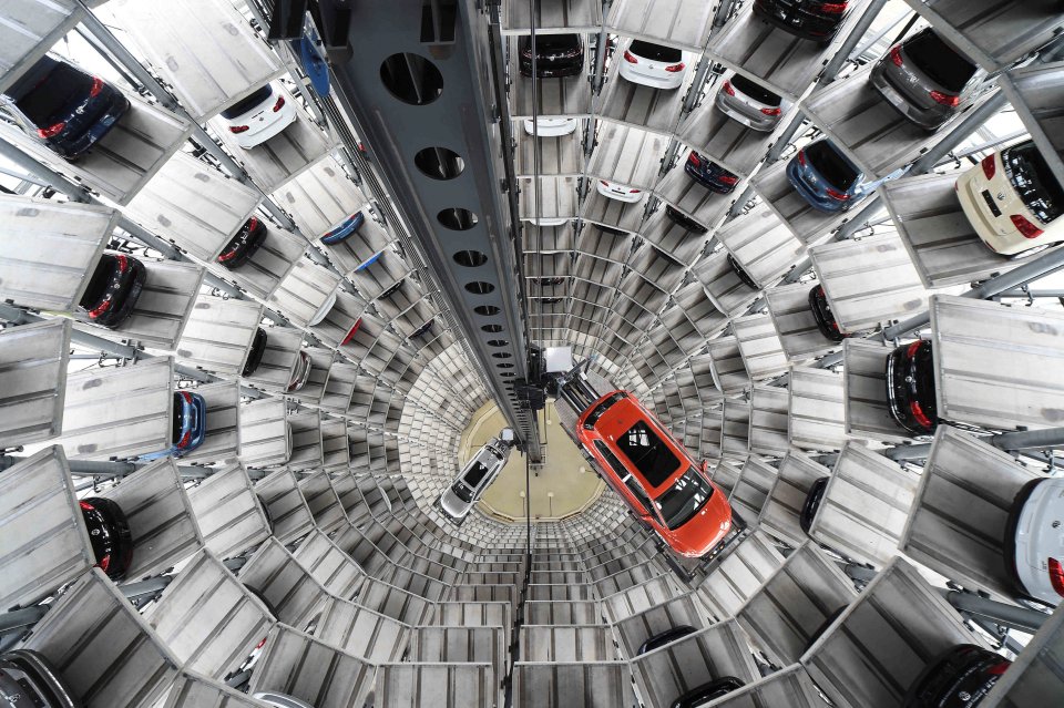 Volkswagen cars in a multi-story automated parking system.