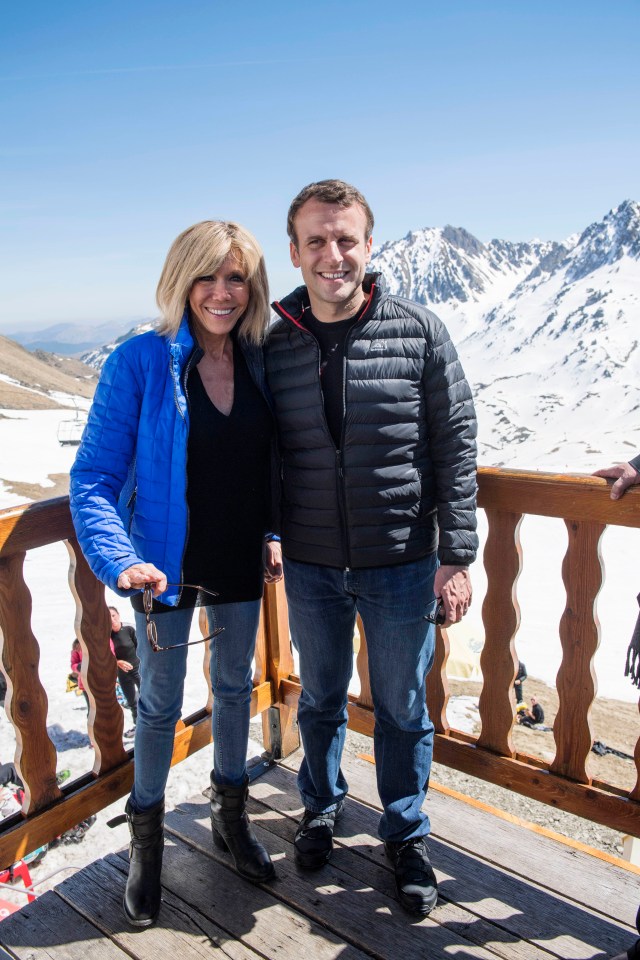 Emmanuel Macron and his wife Brigitte Macron on a mountaintop.