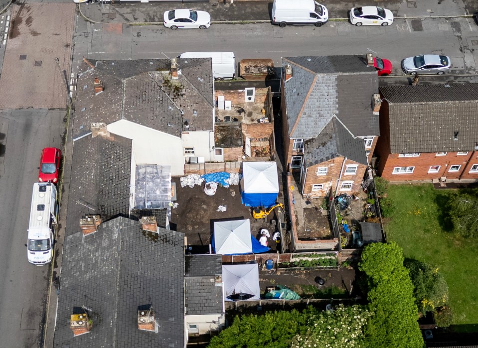 Aerial view of a crime scene investigation in a residential area.