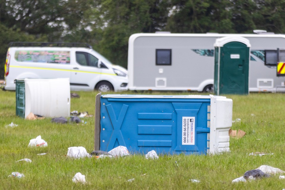 Overturned portable toilet and litter at Appleby Horse Fair.