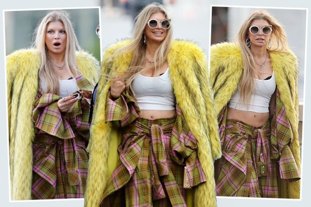 Fergie in a yellow fur coat and plaid pants.