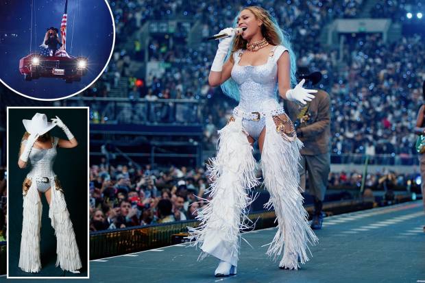 Beyoncé performing in a white fringed chaps and bodysuit.